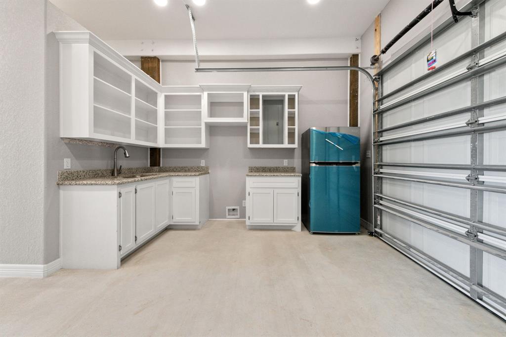 Discover convenience and versatility in the fully-equipped kitchen located downstairs in the converted garage.  Ideal for entertaining or accommodating guests, this space offers all the amenities needed for culinary creations and gathering with loved ones.