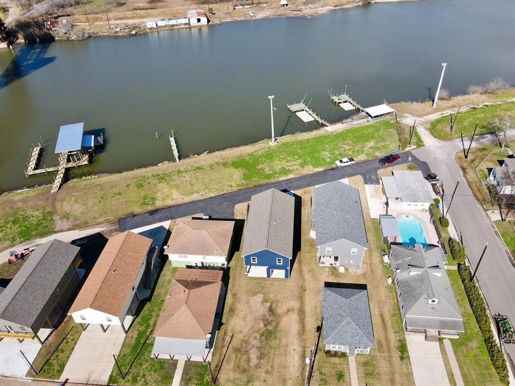 Private road in front of property for W 1st St riverfront properties with an automatic driveway gate offering both security and peace of mind. Shading is approximate - buyer to verify.