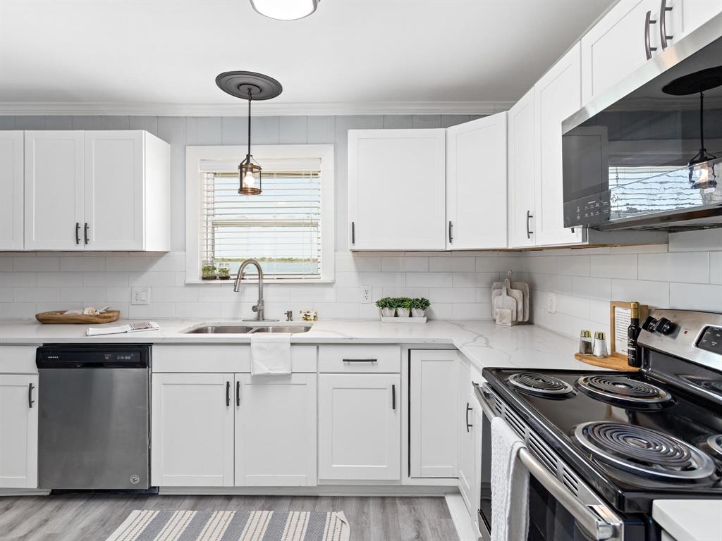 Now into the kitchen.This kitchen offers lots of counter space and tons of cabinet storage.