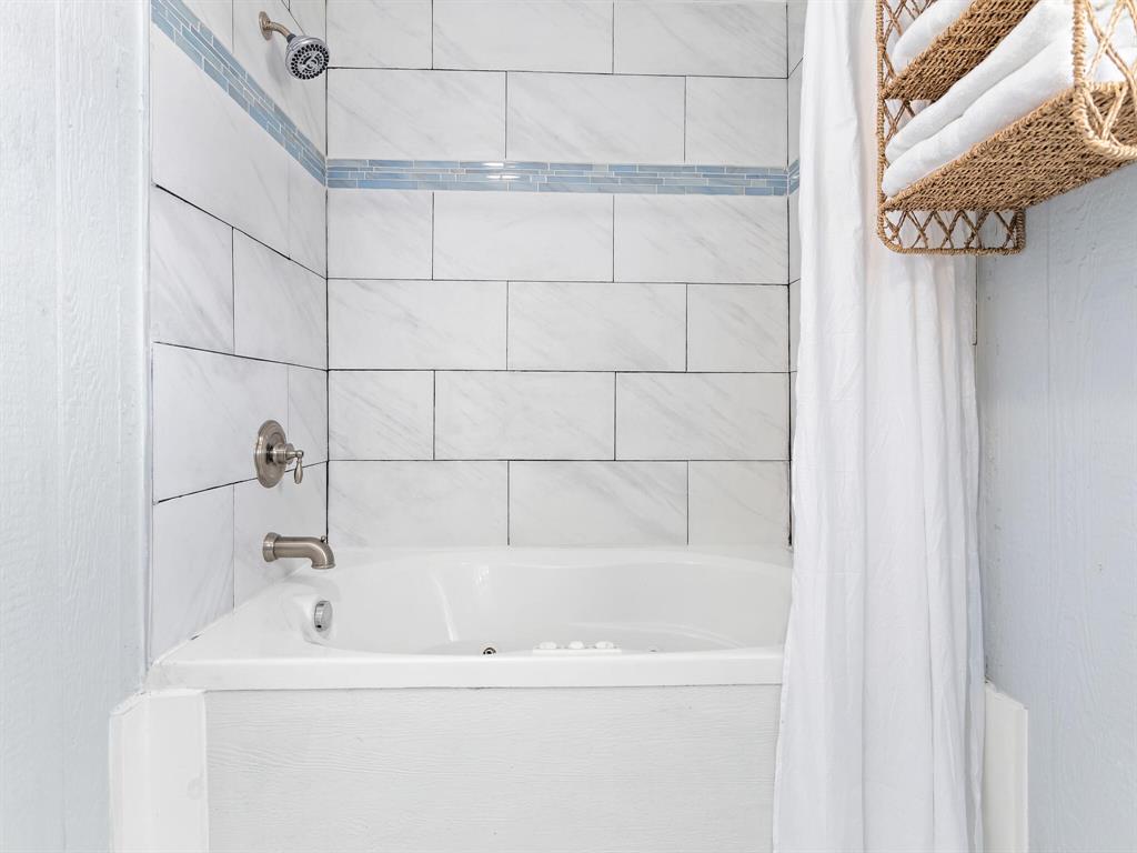 The soaking tub is a perfect space to sink in and relax.