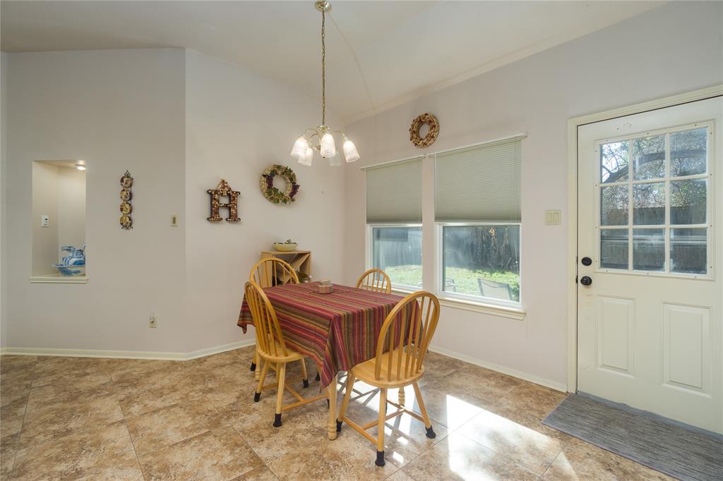 Breakfast room has great view of (and easy access to) back yard.