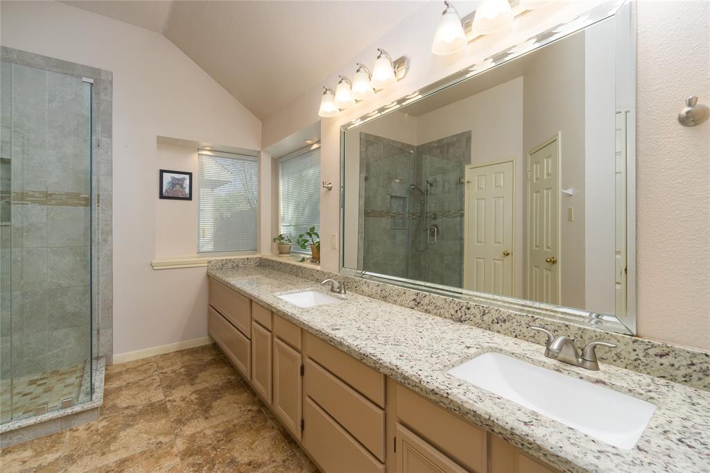 Beautiful granite counter tops in the updated (2017) primary bath. Dual sinks. Tons of cabinet storage.