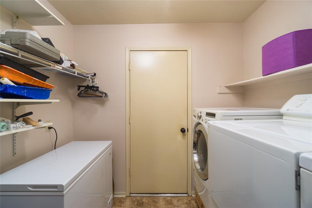 Utility room is located between bedrooms and has access to the garage entry. Extra space (left side) can be used for deep freezer or can be converted into more storage space or a mud room.