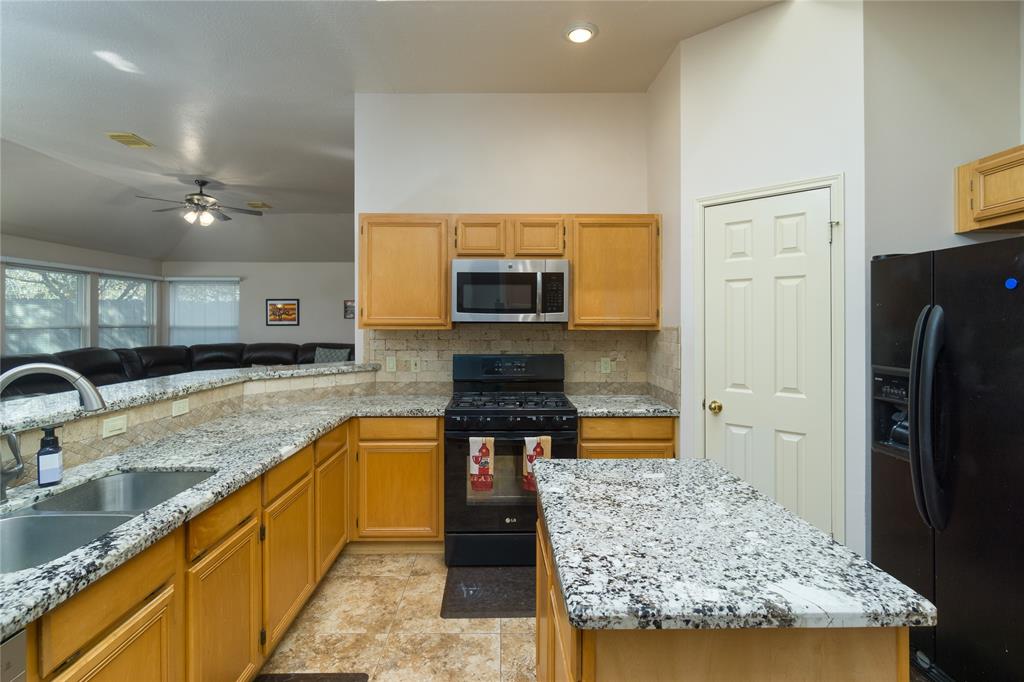 Spacious pantry is located to the right. The kitchen has easy visibility to the family room.