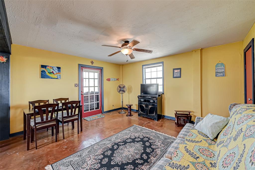 Living/Dining room combo downstairs with access to outside and attached garage