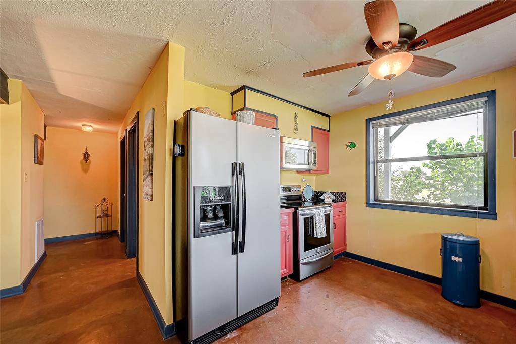 Kitchen features updated stainless steel appliances