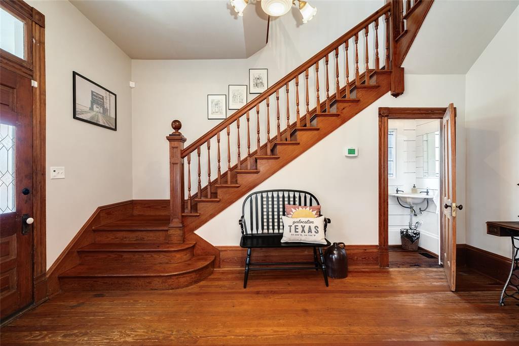 The half bath is tucked away under the stairway and features the timeless appeal of the historic lifestyle.