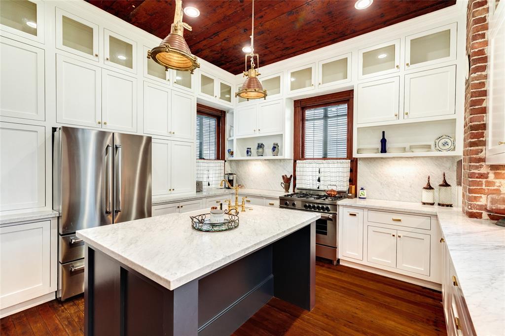 With floor to ceiling custom cabinetry wrapping you in style and function, this kitchen will be your happy place for entertaining, preparing, and a lifetime of personal expression.