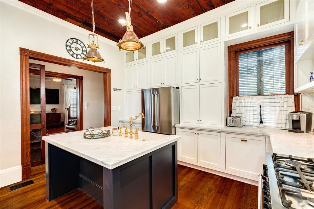 Notice the kitchen island provides space for two to snug up to the counter to visit with the chef.