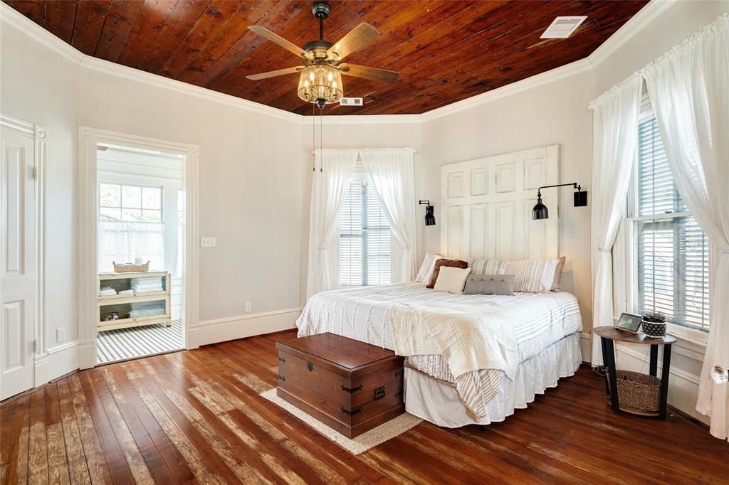 The primary bedroom is relaxed and large. It features high ceilings, a dreamy vintage en-suite, and room for king sized furniture.