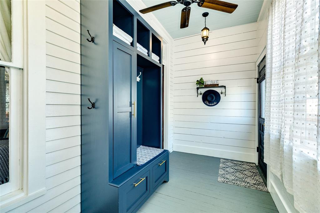 This view of the mud room shows the ample storage and easy access to the back yard deck on the right.