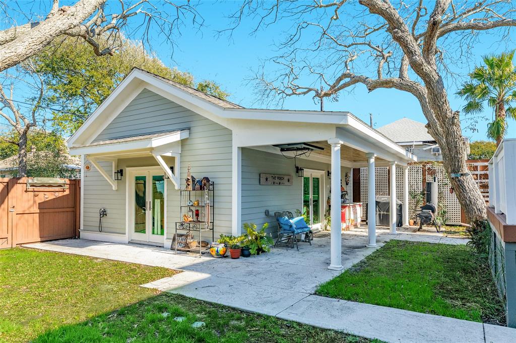 This view of the recently completed garage shows the deep, covered patio and double wide side door entrance to this flexible space.