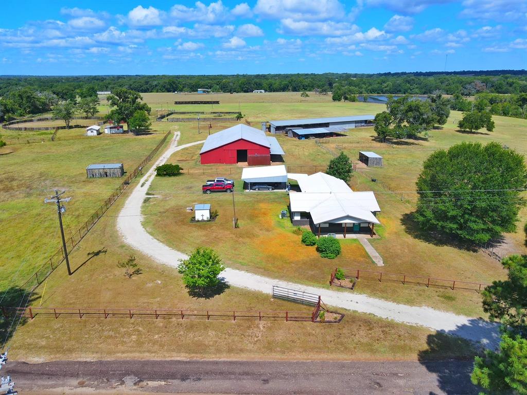 Located on CR 278, halfway between Buffalo and Centerville, in the heart of Leon County is a highly improved horse and cattle ranch with 2 horse barns. One barn is a 40'x185' metal barn with 20 plus stalls, wash bays, storage room, and bathroom with septic. The other barn is a 62'x105' red wood barn with metal roof and has stalls, tack room, and wash rack. This ranch also includes riding arena, electric horse walker, cutting pen, and a caretaker cabin. The property has two smaller turn outs with shelters complemented by pipe fencing and a country style 3 bedroom and 2 bath metal roof home that has been completely remodeled. Attached to the house is a 3-car metal carport on a slab. This property has a deep water well as well as a shallow water well, plus community water meter. The ranch consists of 43.92 acres that fronts on a blacktop county road on two sides and has 2 small ponds for watering livestock.