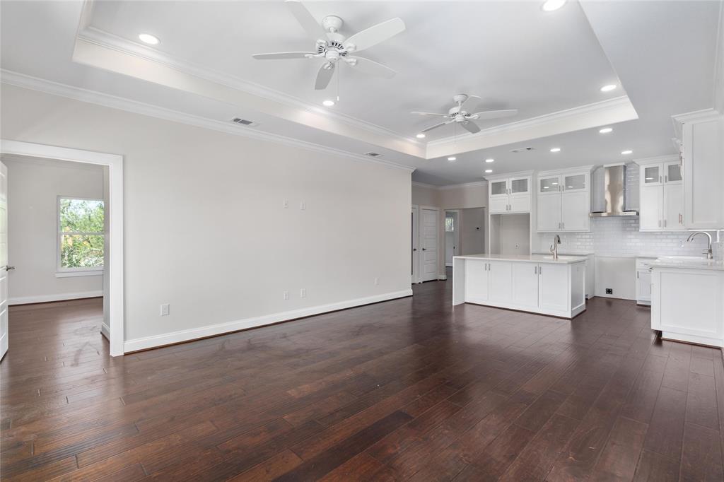 Family room with door way leading to primary bedroom.