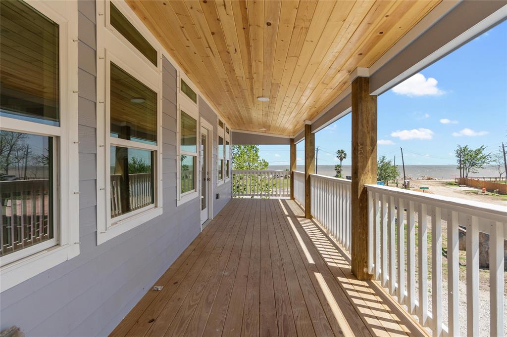 Stained pine lap joint ceiling and Galveston Bay view