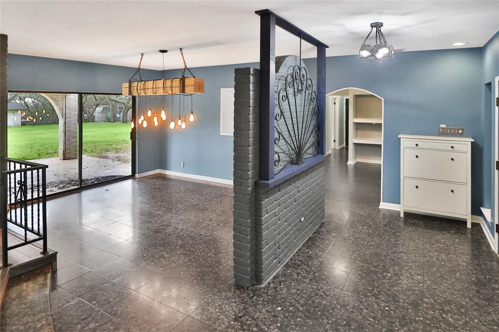 Entering the home you are met with an entryway. Formal Dining area.