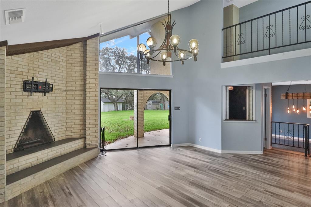 Large living area looking to the outside. The door / bar area is the wet bar.