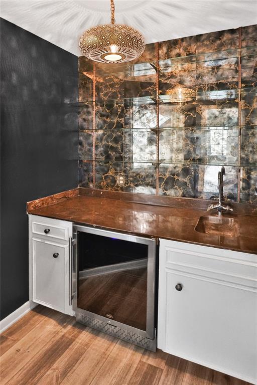 Gorgeous, rustic wet bar with beverage cooler.