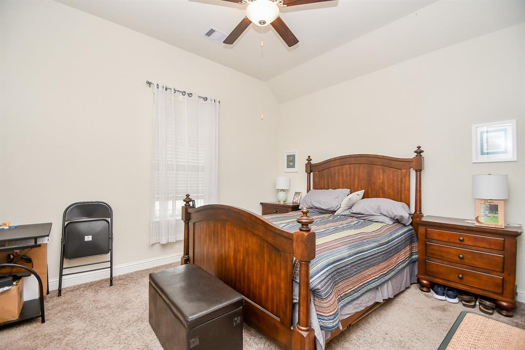 This spacious front bedroom is conveniently located just steps away from the front private office and full bath.