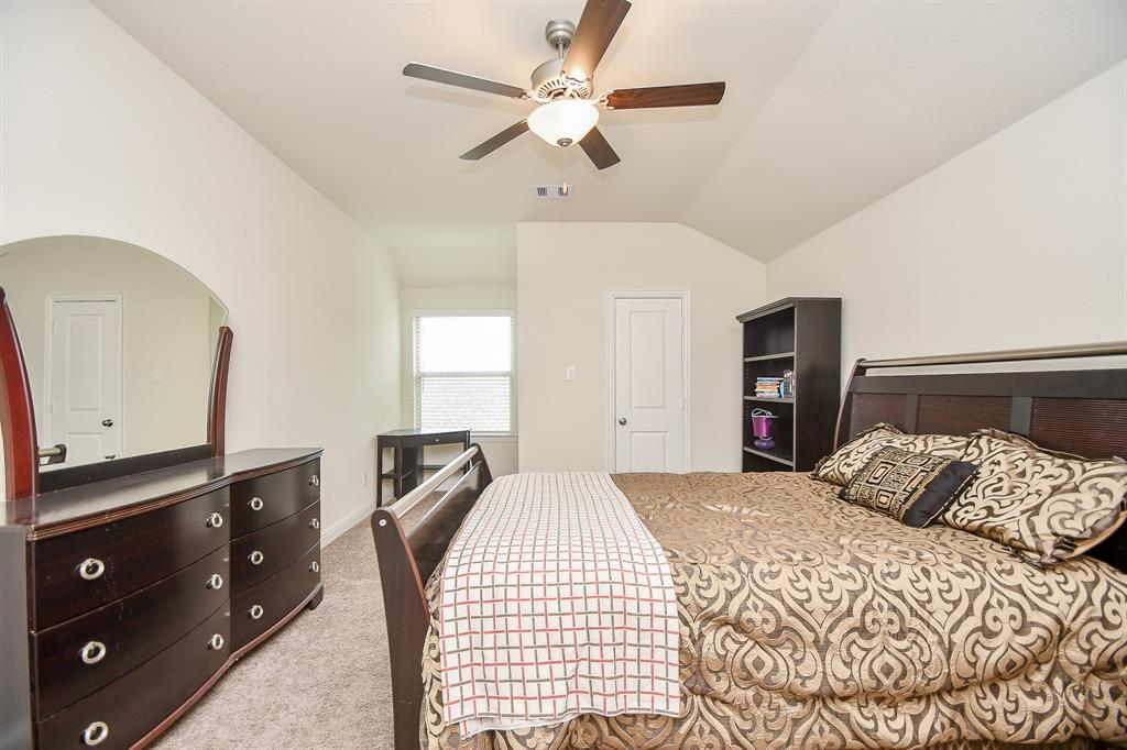 Spacious bedrooms with large windows welcoming natural light are a hallmark of this beautiful home.