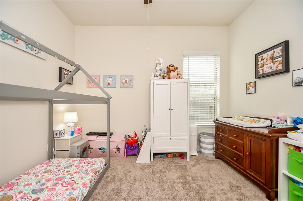 This spacious bedroom, located just off the family room area, offers versatility for accommodating family members, visiting guests, or any other purpose you could dream up.