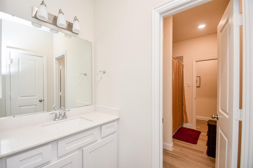 Take a look at the shared full bath, a Jack and Jill setup, serving the upstairs bedrooms.