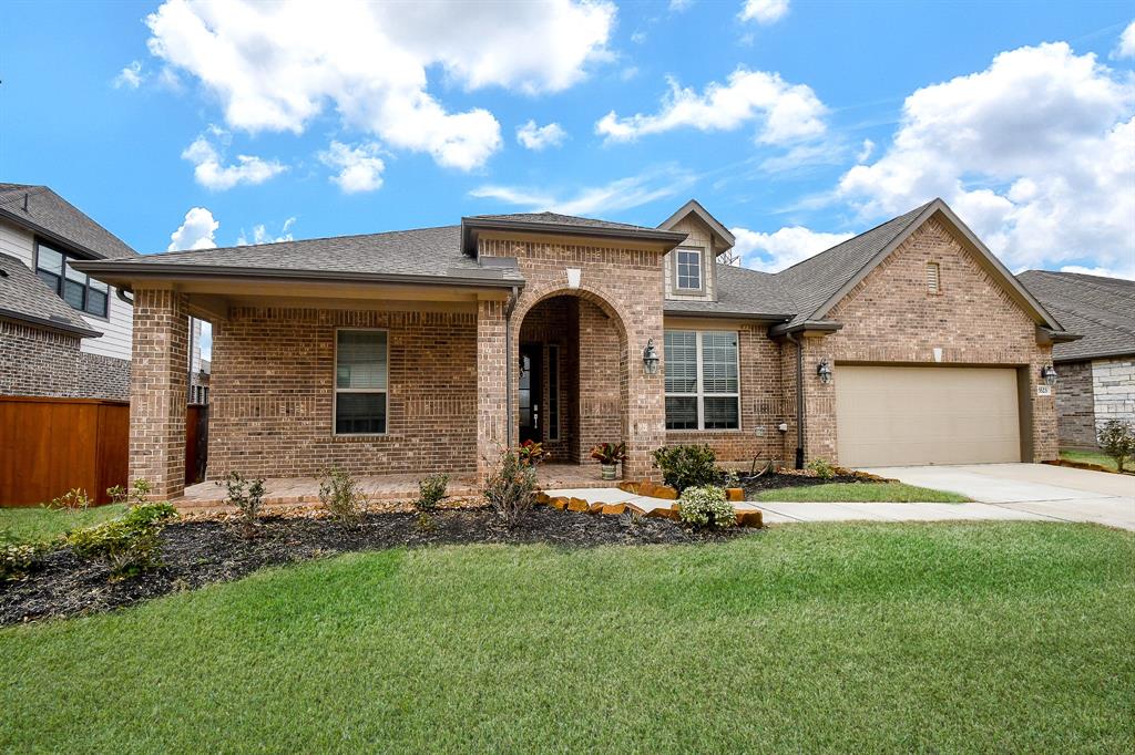 Step into serenity as you\'re greeted by the expansive front porch of this remarkable home, mirroring the spaciousness found within.