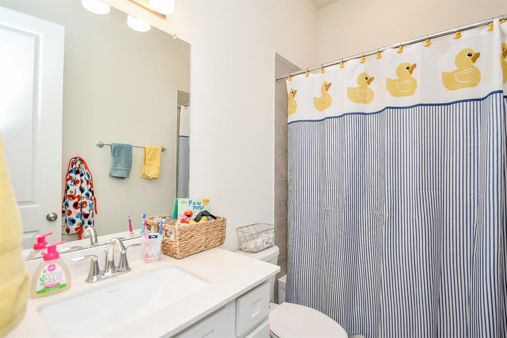 This full bath is privately and conveniently located for the downstairs bedroom, just off the family room area.