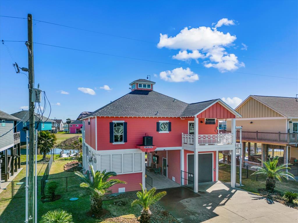 Oversized garage and plenty of parking. Welcome to 2296 E Crab St in Crystal Beach.