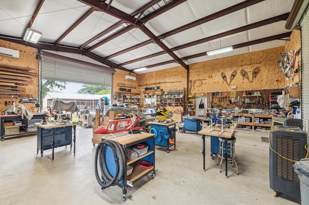 The interior of the barn is clean and spacious.  Currently being used for a woodworking shop, the barn could be comfortably converted into a party barn or used for storage