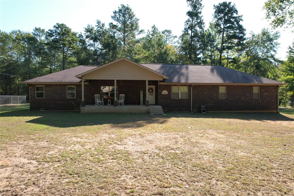 This gorgeous, turn-key estate offers an exceptionally well-maintained three bedroom, two bath brick home on 32.515 acres. From the four-wheelers, to the furniture, and the deer stands and feeders, everything you see is sold with this property! The home has a great floor plan with a cozy living area and spacious eat-in kitchen with custom cabinetry, great countertop space, and stainless appliances. The primary bedroom has a private bath, while two guest bedrooms share a hall bath. This home is loaded with extras such as new double pane in-swing casement windows, and an attic fan. On the property, you will enjoy the easily navigable and well-maintained trails for exploring nature. There is a creek running through the property that provides year-round water for wildlife.  The property also includes an attached oversized 30x30 insulated garage, and a 30x40 shop for storing maintenance equipment and toys. You will not forget this property once you see it in person! Call today!