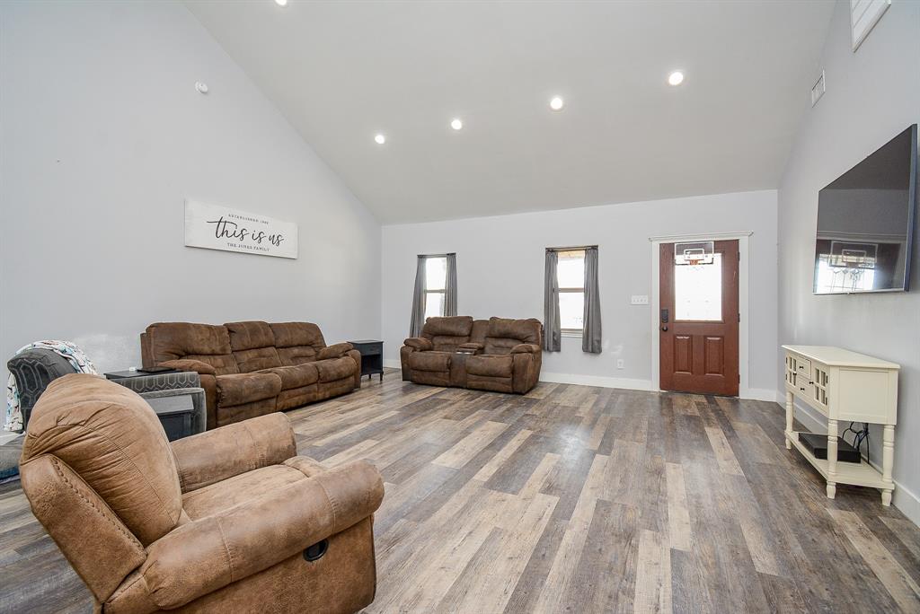 This is a homey view from the interior of the living/family space to the front door.