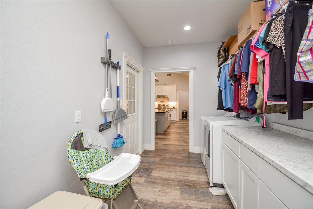 This utility room is comfortably and conveniently located right off the kitchen area!