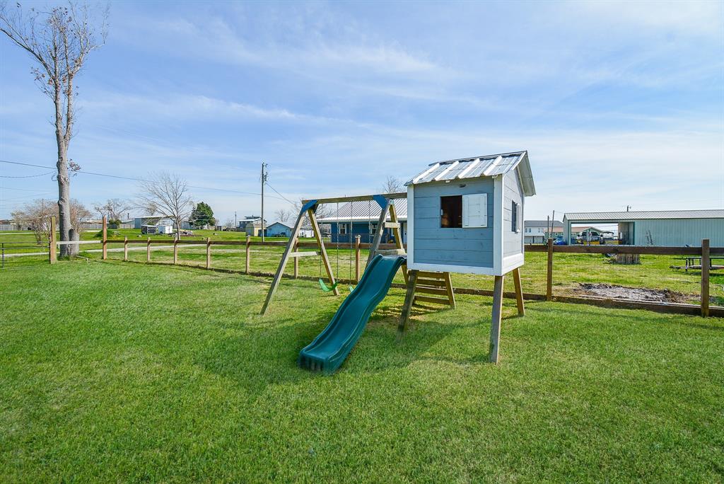 The little ones may find this elevated shed structure the perfect playhouse!