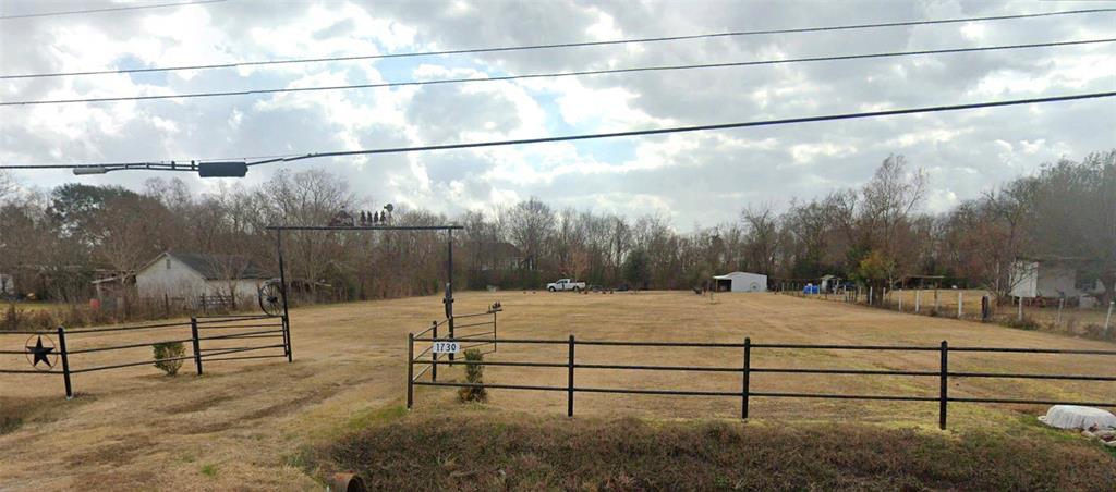 Come build your dream home on just over one acre. Great location with easy access to FM 1942, FM 2100 and Highway 90. Property has a pipe gate that is set back from the road for easy access when pulling in with a trailer.
Six oak, 2 pecan and 1 maple trees.  Metal building is 20x40, a room that is partially insulated with windows and covered front porch.