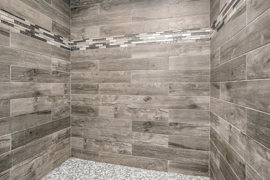 Beautifully constructed oversized primary shower.