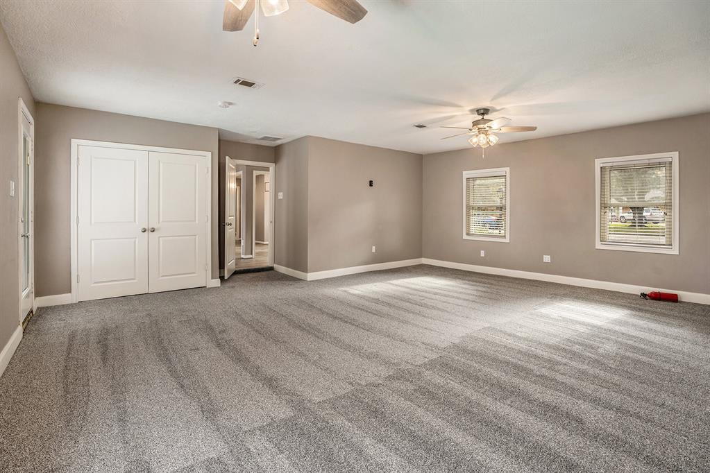 Secondary bedroom with built ins. Full bathroom across the hallway.