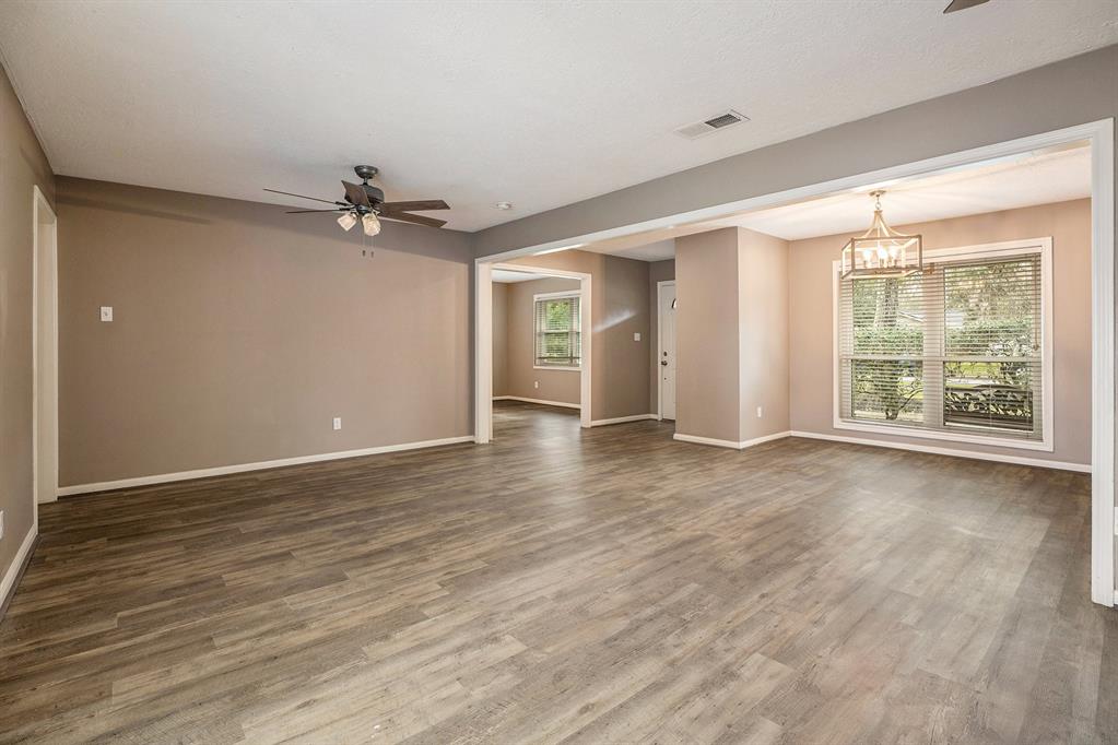 Inside the front door, a flex room to the right and the living room with access to the backyard to the left. The bedrooms are straight down the hallway ahead.