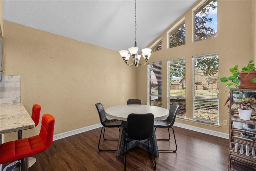 The breakfast room is bathed in gentle, casting a soft glow over the cozy nook creating a warm and inviting ambiance that encourages leisurely mornings and lively conversations.