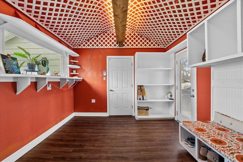 The back door  and the door leading frm the garage opens into this bright and happy mud room. A place to put your purse, keys, shoes and coats.