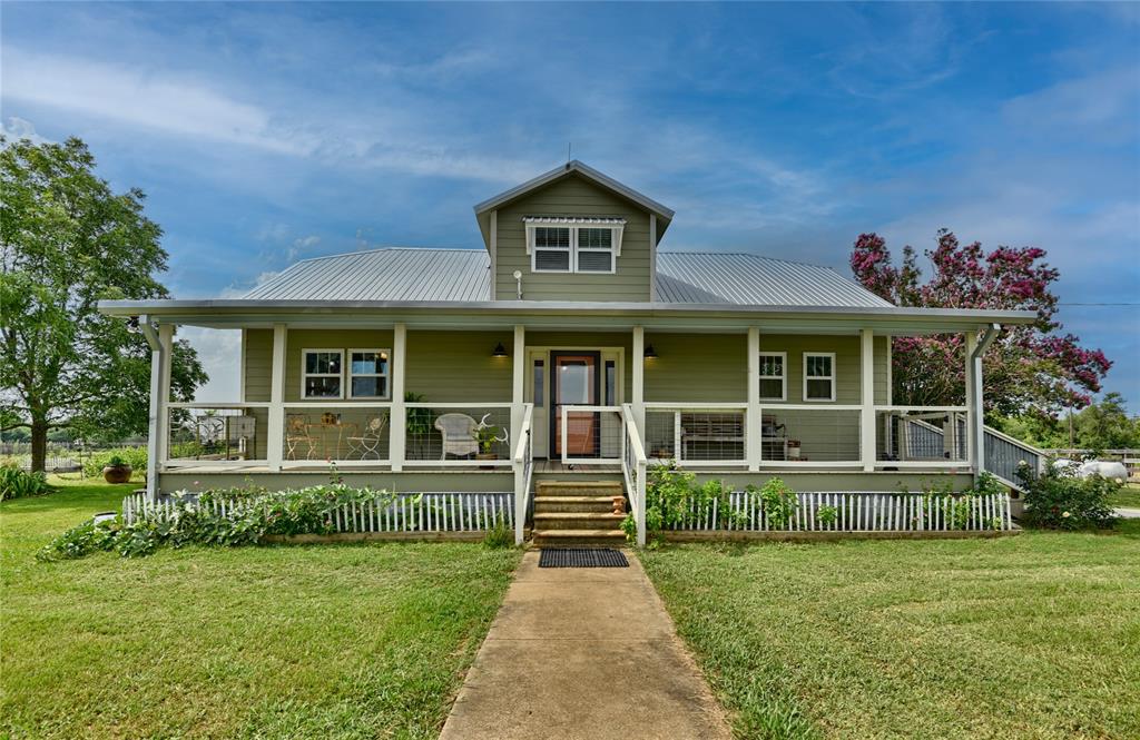 Drive down the 1.5 mile tree lined road to this recently updated & remodeled charming modern farmhouse w/ garage/workshop & barn on 123+ secluded ag exempt acres! Roomy layout is 1912 SF per appraiser + 403 sf enclosed sunroom w/mini split. Enjoy beautiful views from the covered front porch or back deck, serenity, privacy, amazing sunrises/sunsets, dark sky at night for stargazing, almost a constant gentle breeze. Garden & abundance of wildlife including deer, hogs, turkey and dove for excellent hunting.  5 ponds, fully fenced with cross fencing, wooded areas and open pastures.  Updates include HVAC, metal roof (2021), hardy siding, windows, appliances, electric panel/pole, plumbing & enclosed back porch.  Fabulous gourmet kitchen w/gas cooktop & double drawer dishwasher! Garage can be converted into living space. Covered BBQ on small slab & pole barn used for storage.  Public water; 2 water wells not operating per seller can be redrilled. Washer, Dryer, fridge convey; Minerals nego.