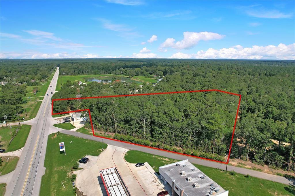 COMMERCIAL ACREAGE OPPORTUNITY! This lightly wooded 5.578 acres with a pond is located on the corner of FM 2090 and Goodson Rd. It provides excellent frontage to both FM 2090 and Goodson Rd. Fantastic commercial opportunity within a minute or so from US 59/69. With over 9,000 cars traveling daily down FM 2090, it's a hot spot for new business. Roughly 10 minutes from 99 Grand Parkway. Single-family home located on the property but no value was given.