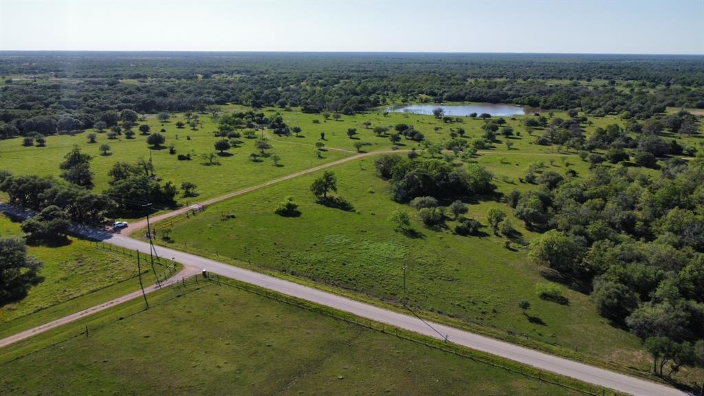 **84.71 Acres Secluded Farm Ranch Land & Wildlife Retreat**RARE:Unrestricted No Zoning Area**Located between Victoria & Yoakum.This beautiful acreage & country retreat offers a large water pond stocked w/ Bass & Catfish. Cattle/Livestock Pens. Natural & Abundant Wildlife. The perfect setting to build out a relaxing escape from the city with an Estate Home. Sport enthusiasts will appreciate the White Tail Deer, Turkeys, Doves, Quail. Hard & Soft Wood Trees. Perfect for farming or crops. Recent new fencing. Paved Road Access.**Award Winning Medical Facilities Close**Recreation:Country Clubs, Golf, Famous Shiner Brewery & Local Wineries. Just a short drive to the Gulf Coast Beaches & Fishing including Rockport, Matagorda Island & Port Lavaca. A 20 minute drive to Victoria TX and less than 2 hours from major Texas cities like Houston, San Antonio, Corpus Christi & Austin. Low taxes and AG exmp in place. Grazing leases can transfer. Mineral rights neg. Adjacent Properties Available