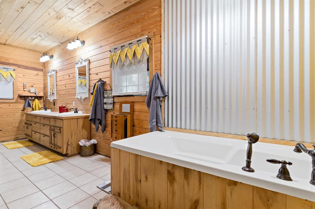 mahogany cabinets and tub siding.