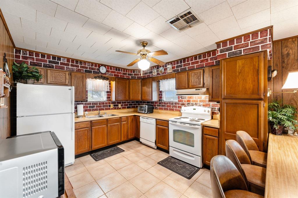 The kitchen is equipped with an abundance of storage space and counter space