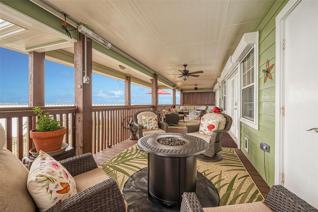 Now let\'s take a tour of the house! Walk up the stairs and enter the home from this big porch. Two rooms open to the porch -- the family room and the primary bedroom.