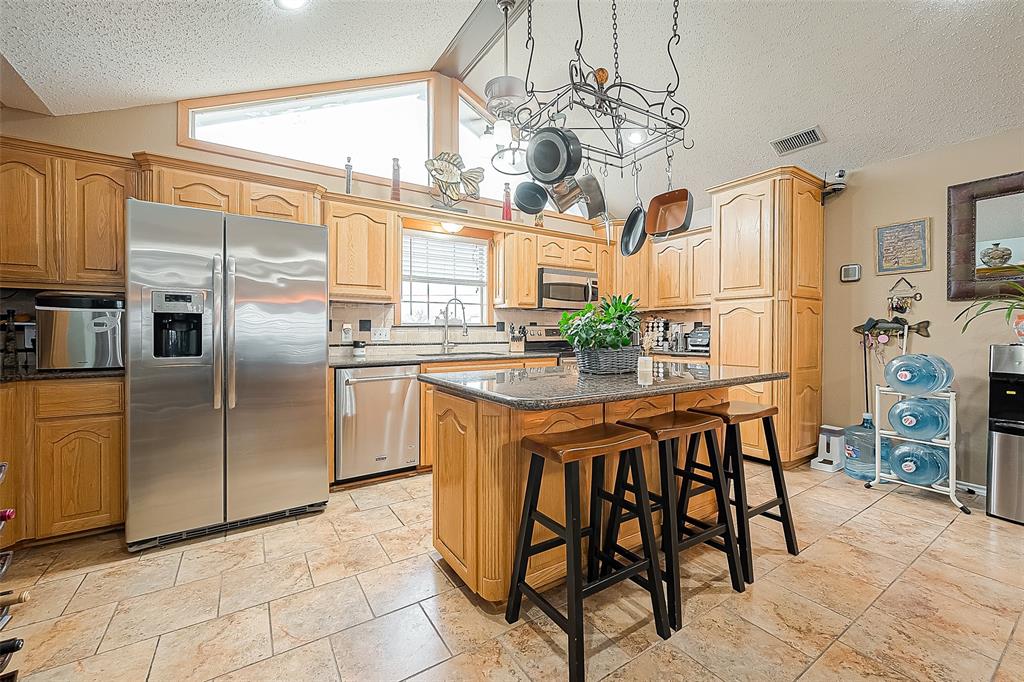 So many cabinets, as well as a handy island/breakfast bar.