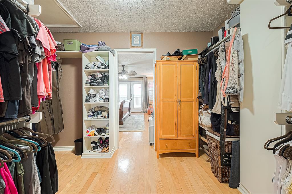 Primary bedroom closet offers a considerable amount of space and a good selection of built-ins -- a great layout!