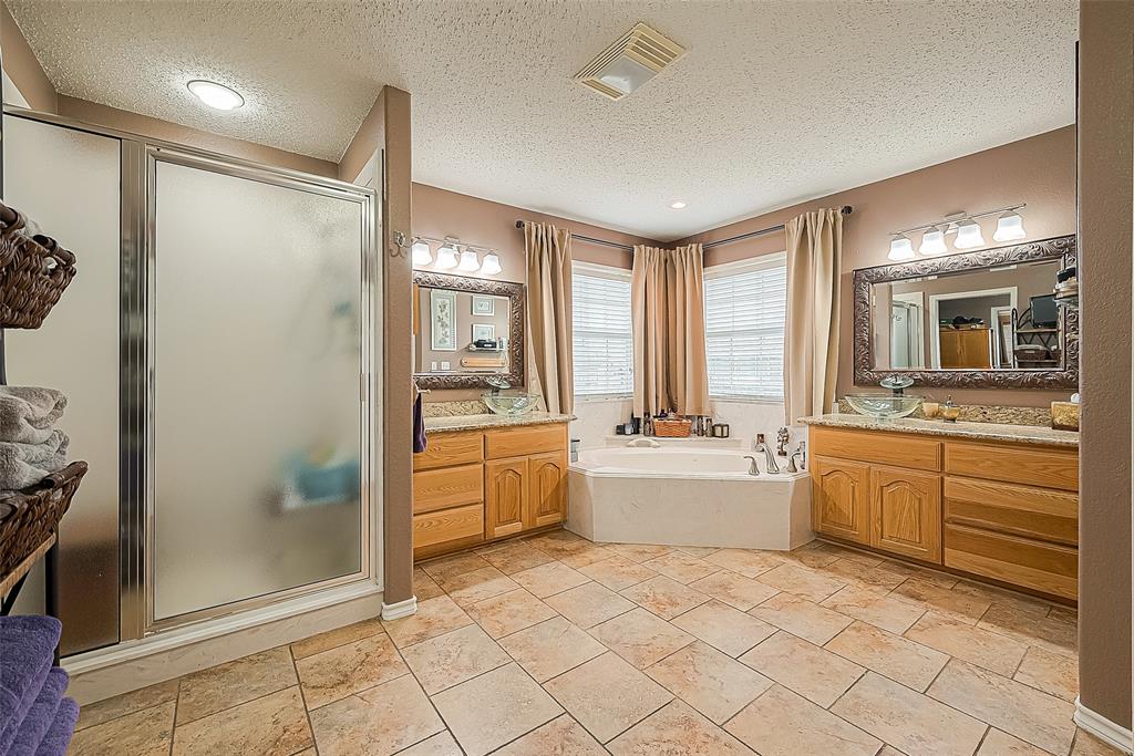 Another view showing the shower. The closet door is on the left.