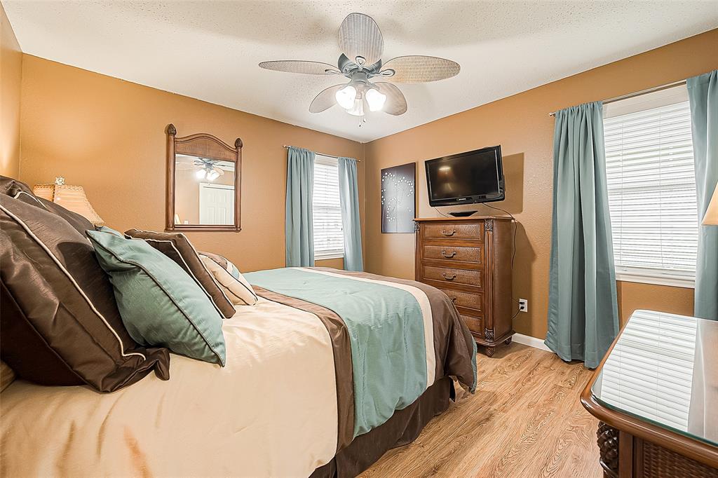 Guest bedroom is located across on the other side of the family room/dining/kitchen area.